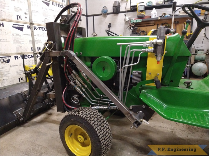 Richard W. from Winchester, ID and his John Deere 140 Pin On loader | Richard W. built this Pin On Loader for his John Deere 140 left side veiw