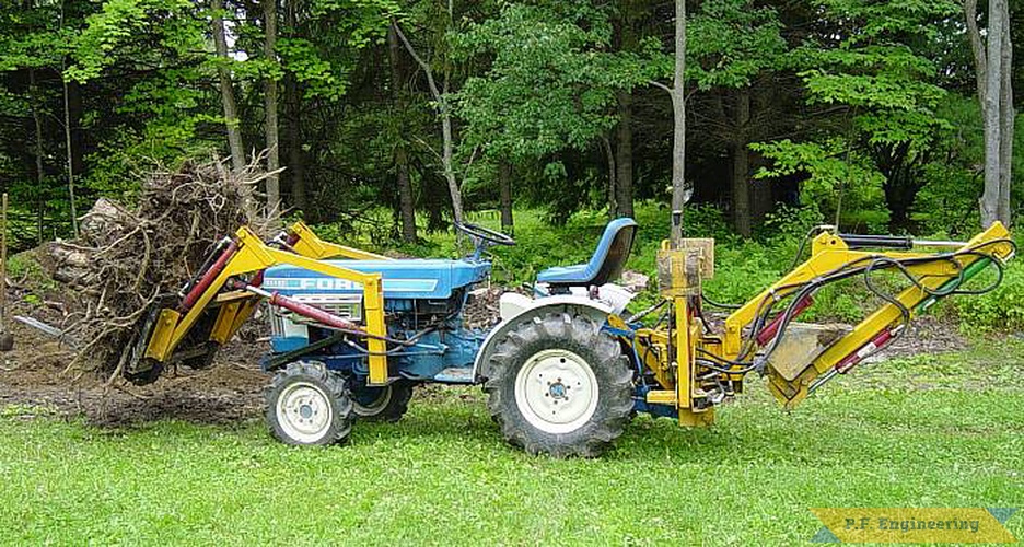 some more pics of the P.F. Engineering prototype front end loader on the Ford 1110 compact Diesel 4WD tractor. seen here lifting a stump i dug out prior to building my new fabrication shop | Ford 1110 compact tractor loader_1