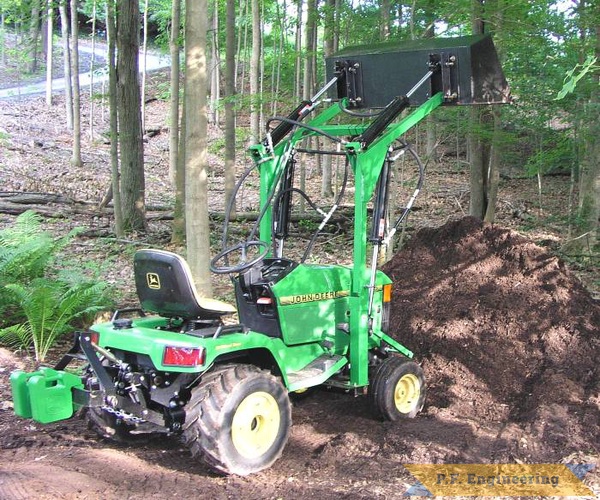 at the pile | John Deere 425 AWS garden tractor loader_1
