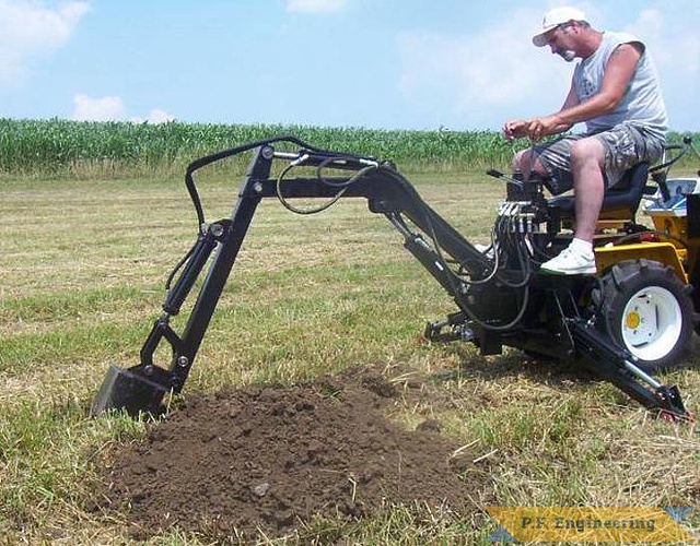 here is Mr. R. himself at the controls of the Micro Hoe. | Cub Cadet 125 garden tractor Micro Hoe_1