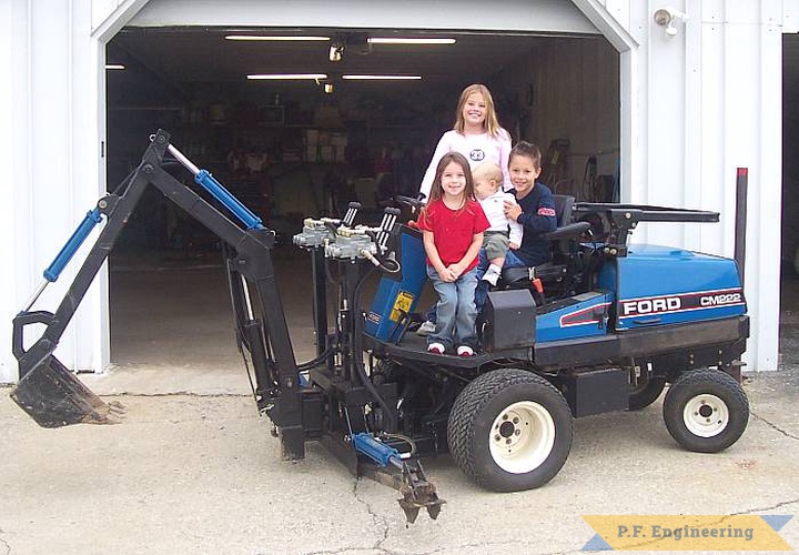 Jim W. from Upper Sandusky, OH  had a neat idea to build a Micro Hoe for his Ford CM222 commercial mower, and it holds all his grandchildren at the same time! | Ford CM222 commercial mower Micro Hoe attachment_1
